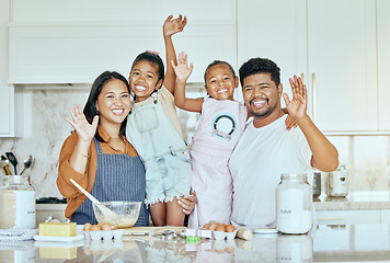 Image showing Family, love and baking together in kitchen with smile, happy and wave with ingredients on counter or table. Portrait of girl kids, mother and father enjoy cooking or bake while bonding in home