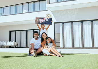 Image showing Property, happy family and sold sign with smile, relax and excited people rest, sit and bond on grass. Real estate, house sale and family moving into new home together, joy and carefree relocating