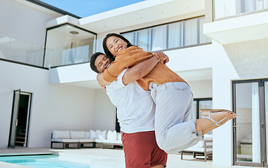 Image showing Hug, real estate and couple moving into their new home while excited, happy and with smile together. Portrait of a young, hugging and man and woman with love and happiness at their dream house