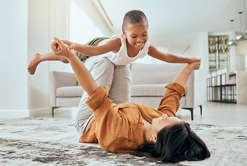 Image showing Mother, girl love and playing airplane fly in air bonding activity together in the house living room. Happy mom, excited laugh child or kid and fun game spend quality time on floor at family home