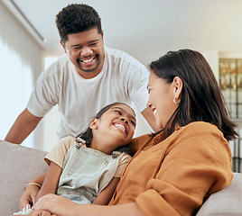 Image showing Family, mother and daughter hug with father standing at lounge sofa in Philippines home. Love, care and affection embrace of filipino mom bonding with happy child on couch in living room.