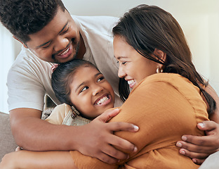 Image showing Asian family, parents and child hug on sofa bonding, love and affection in family home. Indian father, mother and girl relax together loving embrace, happiness and hugging on couch, enjoying weekend