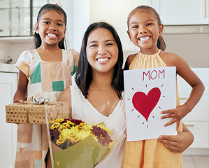 Image showing Mothers day, birthday and happy family children with gift, celebration flowers and heart card to celebrate mama. Love, youth girl and portrait of kids giving mom surprise, bouquet and present box