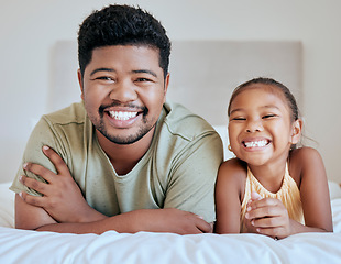 Image showing Asian, dad and girl on bed, lying and together with smile, happy and portrait in bedroom in house. Father, child and happiness in room for bonding and care while relax in family home in Jakarta