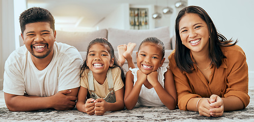 Image showing Happy family, relax and portrait on home carpet with young and cheerful filipino children. Daughter, mother and father smile on floor together with happy kids in Philippines family home.