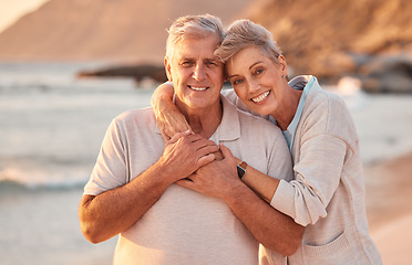 Image showing Couple, senior and beach with smile, hug and love on holiday, vacation or relax with romance. Elderly, woman and man by sea, ocean or waves for portrait, together or care in retirement with happiness