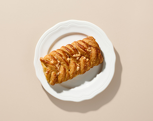 Image showing freshly baked sweet bun on white plate