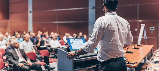 Image showing Public speaker giving talk at Business Event.