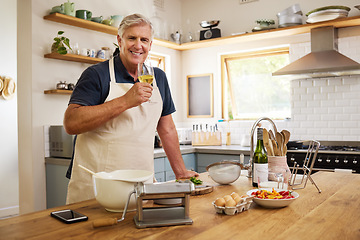 Image showing Elderly man drinking wine while cooking in kitchen for date, dinner or lunch in his home. Happy, smile and senior guy in retirement enjoying glass of alcohol beverage while preparing food at a house.