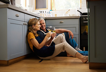 Image showing Love, senior couple and on kitchen floor, together and bonding while speaking, talking and with wine. Romantic, retirement or elderly man and woman being loving, romance and anniversary or discussion