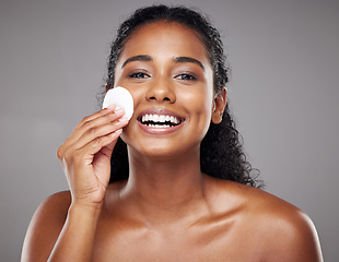 Image showing Skincare, beauty and portrait of black woman with cotton pad to cleanse face. Beauty products, facial and girl clean makeup, cosmetics and skincare products for healthy skin, wellness and body care