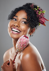 Image showing Protea flowers, happy woman and natural beauty, glowing skincare and organic eco makeup, aesthetic wellness or floral perfume on studio background. Happy young model face, plants and herbal cosmetics