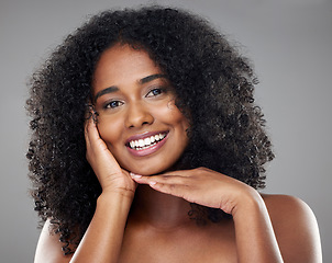 Image showing Black woman afro, beauty and smile for skincare, cosmetics or treatment against a grey studio background. Portrait of happy isolated African female smiling with teeth satisfied for perfect skin