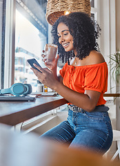 Image showing Phone, coffee and woman on social media at a cafe relaxing while enjoying trendy news and online content. Smile, entertainment and happy girl reading posts on a social networking app in a restaurant