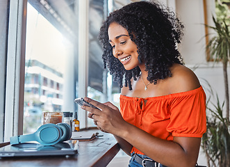 Image showing Coffee shop, black woman and phone while happy, excited and typing on phone for communication app with cafe wifi. Freelancer female on internet to blog, social media and do remote work on internet