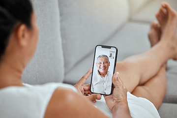 Image showing Video call, smartphone and a woman on sofa talking to happy elderly man on screen in living room. Technology, communication and love connection, relax and chat on video phone call using mobile app.