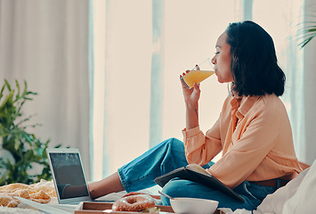 Image showing Relax, laptop and woman streaming a movie for brunch in a hotel or house bedroom enjoying a holiday vacation. Relaxed, peaceful and calm girl drinking orange juice and watching film on subscription