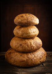 Image showing Four bread arranged in a pyramid formation