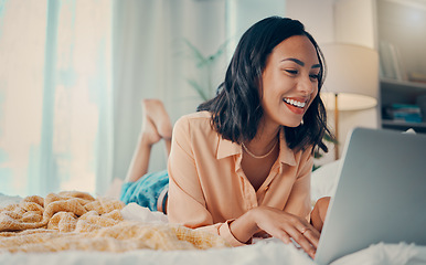 Image showing Bed, laptop and relax with a woman blogger or freelance worker doing remote work from home while lying in the bedroom. Computer, email and technology with a female working on her blog in a house