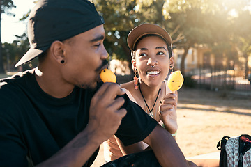 Image showing Ice cream, sweet and couple in city with food during travel, adventure and holiday in street. Happy, young and relax man and woman eating ice dessert on a date during vacation in a park during summer
