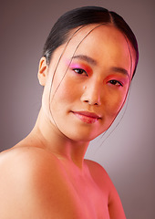 Image showing Futuristic makeup, asian beauty and woman in studio portrait with neon light for cosmetics product advertising. Japanese or Korea girl model headshot or face with vaporwave future cosmetic mock up