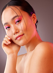 Image showing Portrait, Asian woman and makeup for natural beauty, wellness and happy with studio background for skincare. Cosmetics, young girl and body care for organic facial, smooth skin and creative neon face