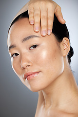 Image showing Beauty, asian woman and skincare, wellness and aesthetic cosmetics, self care and glowing skin on studio background. Portrait Japanese female model, collagen face filler and natural body dermatology