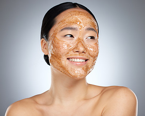 Image showing Exfoliate face mask for beauty skincare, natural product for healthy skin and clean cosmetic wellness for body against grey mockup studio background. Happy, smile and healthcare on Asian woman model