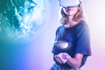 Image showing Vr planet, double exposure overlay and gamer girl with space video game on virtual reality with headset high tech hologram of planet. Woman, futuristic metaverse technology and 5g internet connection