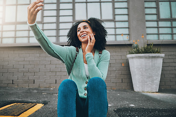 Image showing Selfie, black woman and smartphone in city, happy and smile in the outdoor, streaming live and on sidewalk. Young girl, female and phone being cheerful, trendy and edgy on pavement for happiness.