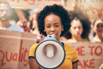 Image showing Protest, loud speaker and rally with a woman activist speaking during a march for equality in the city. Freedom, speech and community with a young female protestor in fight for human rights