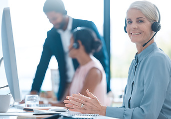 Image showing Call center, contact us and happy customer support employee, insurance agent or sales consultant at a help desk. Smile, telecom and mature woman networking, helping and talking in customer service