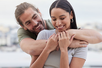 Image showing Care, interracial and hug for love in couple relationship with happy woman holding hands of man. Indian girlfriend of caucasian partner enjoying bonding embrace for affection together in Canada.