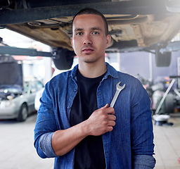 Image showing Man, mechanic and tool in engineering for auto repairs, handyman or service at the workplace. Portrait of professional mechanical employee for vehicle fixing, problem solving or maintenance in garage