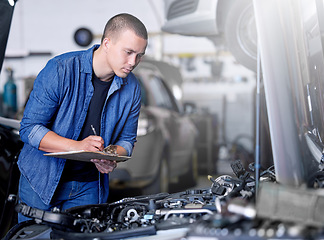 Image showing Car service, inspection and mechanic by car with clipboard checking engine. Technician, engineer and man working in garage or workshop writing notes for repair, maintenance and motor care for vehicle