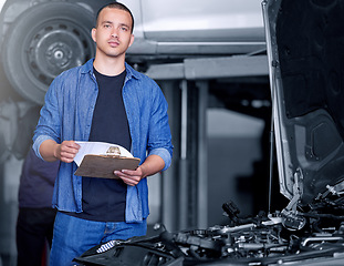 Image showing Engineer, mechanic and car engine manager with checklist working on performance quote. Portrait of man motor technician, repair service and maintenance or diesel vehicle machine oil inspection