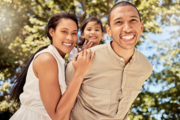 Image showing Family, couple and child being happy, smile and relax for fun, vacation and joy together outdoor. Portrait, man and woman with kid have quality time, bonding and embrace being playful and cheerful.