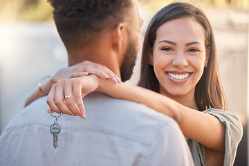 Image showing House keys, new home and couple, real estate property and for sale, buying and rent on home loan, building mortgage and investment. Portrait of happy woman hug partner to celebrate moving in together