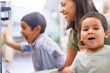 Image showing Mom, kids and oven in kitchen for baking, cooking or cake in home with happy, excited and smile on face. Mother, boy and children in house for preparation of cookies, food or muffin in Los Angeles