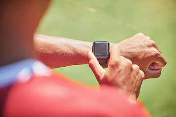 Image showing Smartwatch, screen mock up and fitness hands man check time running results, sports or training workout progress on green pitch field. Athlete on smart watch for exercise goal tech with green mockup