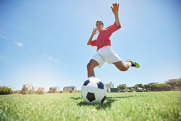 Image showing Soccer ball kick, sport and man athlete ready for team exercise, fitness and exercise game training. Football workout of a soccer player playing sport on an field in nature for cardio and wellness