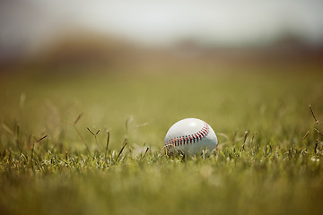 Image showing Baseball, pitch and sports ball on grass on an outdoor field for a game, training or practice. Softball, sport and closeup of equipment for match, practicing or exercise in nature at outside stadium.