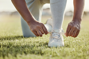 Image showing Baseball field, man and shoes lace tie for sports match with professional game uniform for pitch. Baseball, start and athlete male footwear preparation for sport competition tournament on grass.