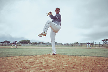 Image showing Baseball pitch, athlete and man from Guatemala ready to throw for exercise, training and game workout. Team fitness, baseball player and sports with teamwork together on a outdoor dirt field