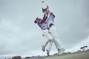 Image showing Sports, action and a men catch baseball, jump in air with ball in baseball glove. Energy, sport and catch, baseball player on the field or pitch during game, professional athlete in game or match