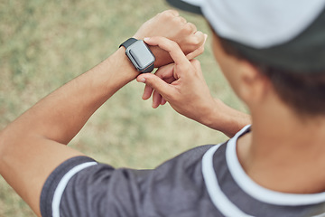 Image showing Fitness, man and watch monitoring sports workout, exercise or training in the nature outdoors. Active male in healthy sport checking wrist technology for time, cardio or pulse in athletic exercising