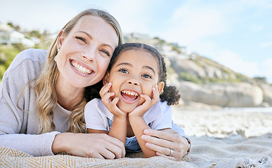 Image showing Mom, beach and girl lying for portrait with love, smile or happy for adoption, outdoor or sunshine. Woman, mother and child on blanket at ocean, sand or sea on holiday, vacation or family in summer