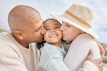 Image showing Family beach, child travel and kiss with parents happy on holiday by the tropical weather on Island in Costa Rica during summer. Latino mother, father and girl with smile on vacation by the ocean