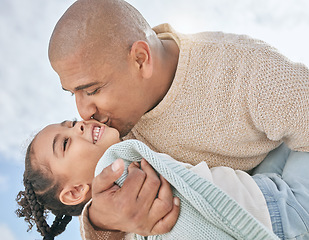 Image showing Love, sky and father kiss kid while having fun, play and enjoy outdoor quality time together for peace, freedom and bond. Black family happiness, clouds and child care for happy youth girl with dad