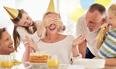 Image showing Surprise, birthday cake and mother with family for celebration, party and excited people. Happiness, love and big family with children cover mom eyes to celebrate mothers day holiday together